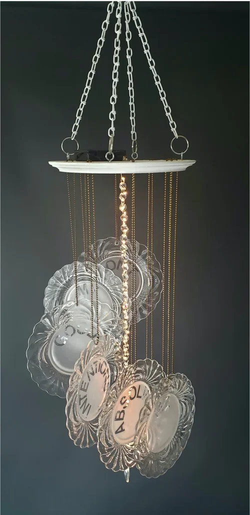 "Don't My Good Intentions Absolve Me of Action" by Michael F. Gallagher, 35” x 12” x 12", Glass, wood, lights, crystals, chain