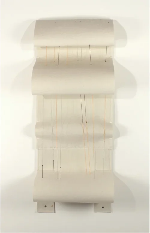 "Imagining neutrinos in a rhythm from pi" by Yvette Kaiser Smith, Felt, carpet warp yarn, roofing nails, grommets, 49 x 19 x 9 in.