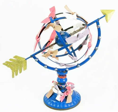 Marie Magnetic, "hang me out to dry", 14" x 18" x 8", Metal globe, string, metal jewelry chains, bracelet, paint markers, push-up bra fabric strips