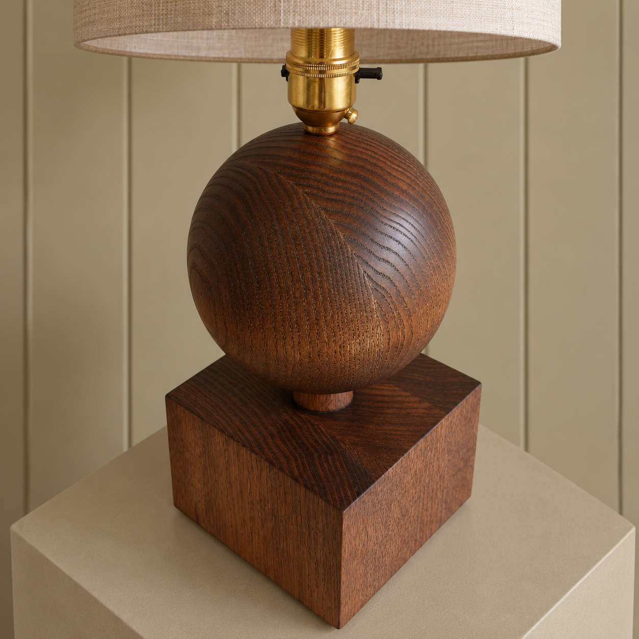 Walnut Sphere Lamp on Stone Plinth.png