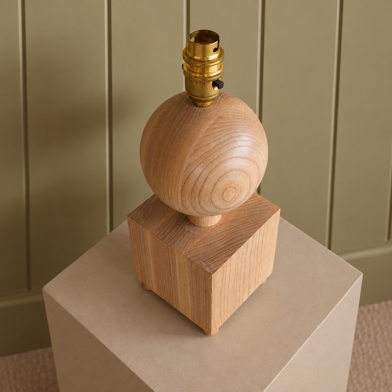 Wooden Sphere Lamp Base in Warm Studio Setting.png