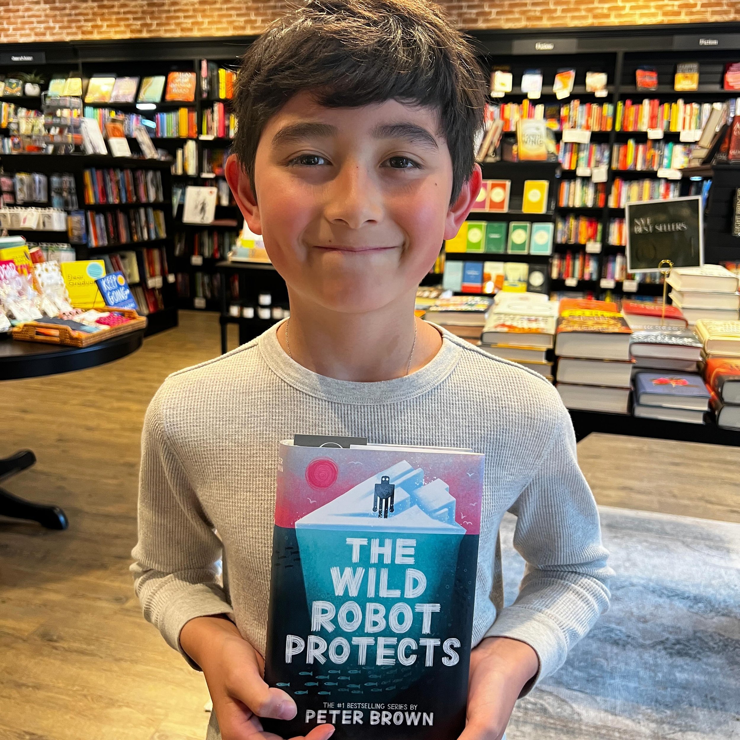 Happy customer! Nine-year-old Ashton had one mission when he walked into @hummingbirdbookstore today: to get the new installment of the Wild Robot series by Peter Brown (@peterbrownstudio). We&rsquo;re thrilled to say he left with a huge smile and hi