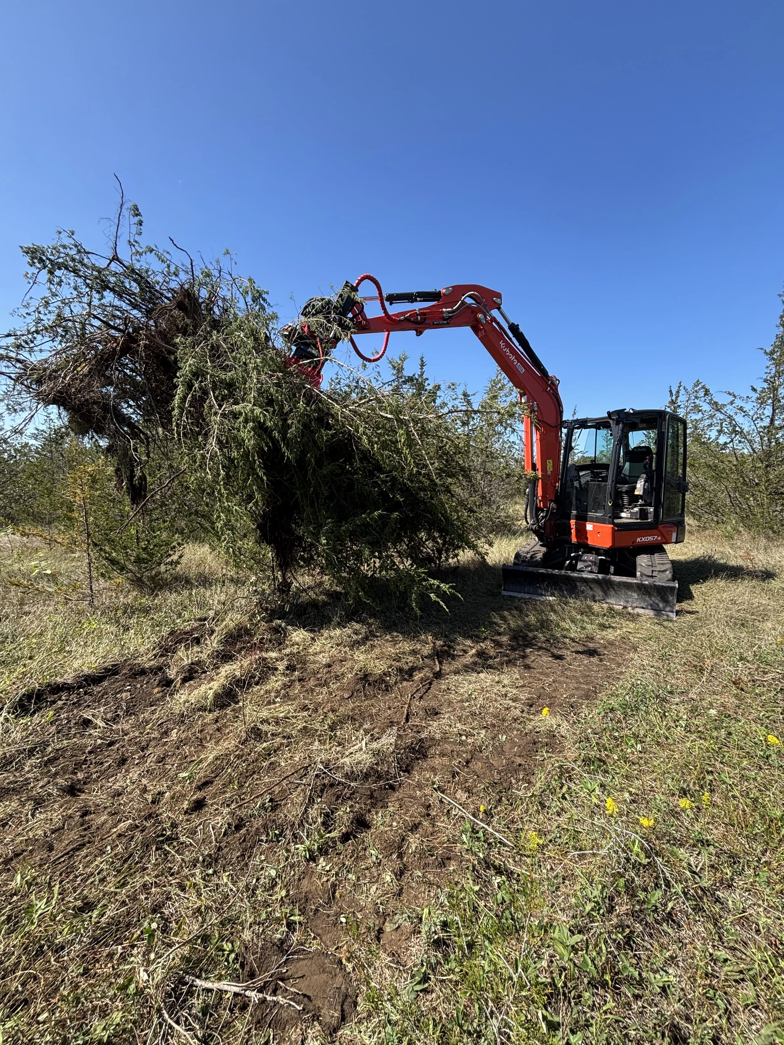 Clearing trees to make way for an ATV and snowmobile trail.  No land clearing project is too big for our setup!