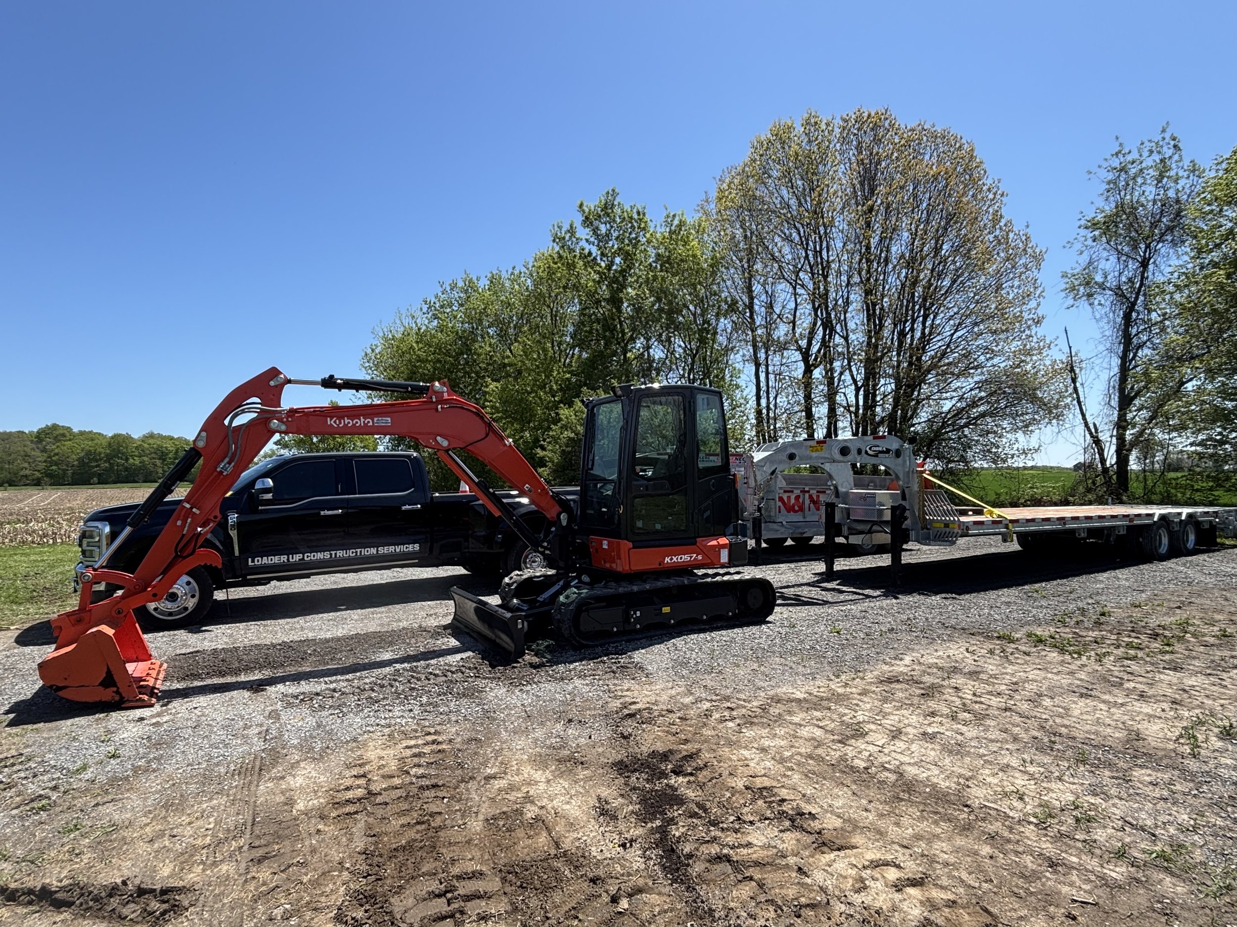 The yard is starting to fill up! The new Kubota excavator fits right in with our 22k equipment float, and 5 tonne dump trailer.