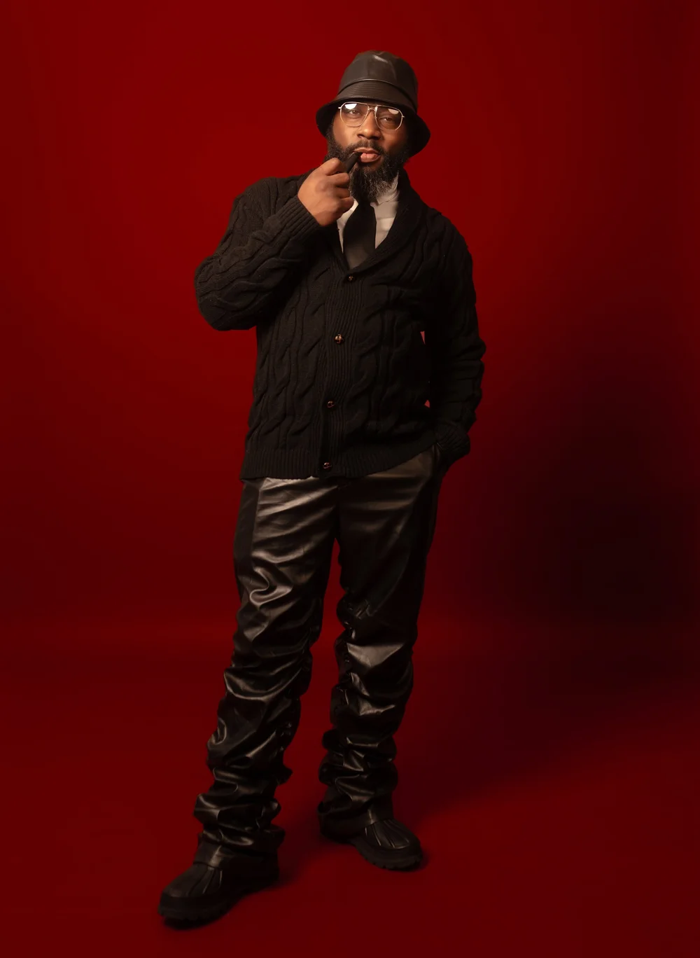 NAW studio portrait against a deep red background
