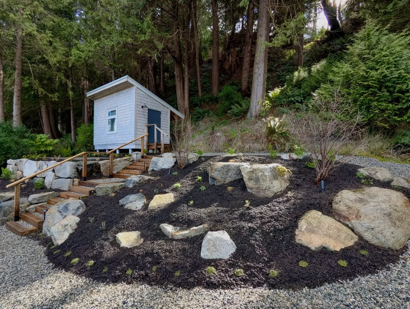 What an incredible transformation for this hillside cabin! ✨ 

We replaced that wild, overgrown Horsetail with stunning boulder retaining walls and clean timber steps, finishing it all off with some thoughtful new plantings. 

What do you think of th