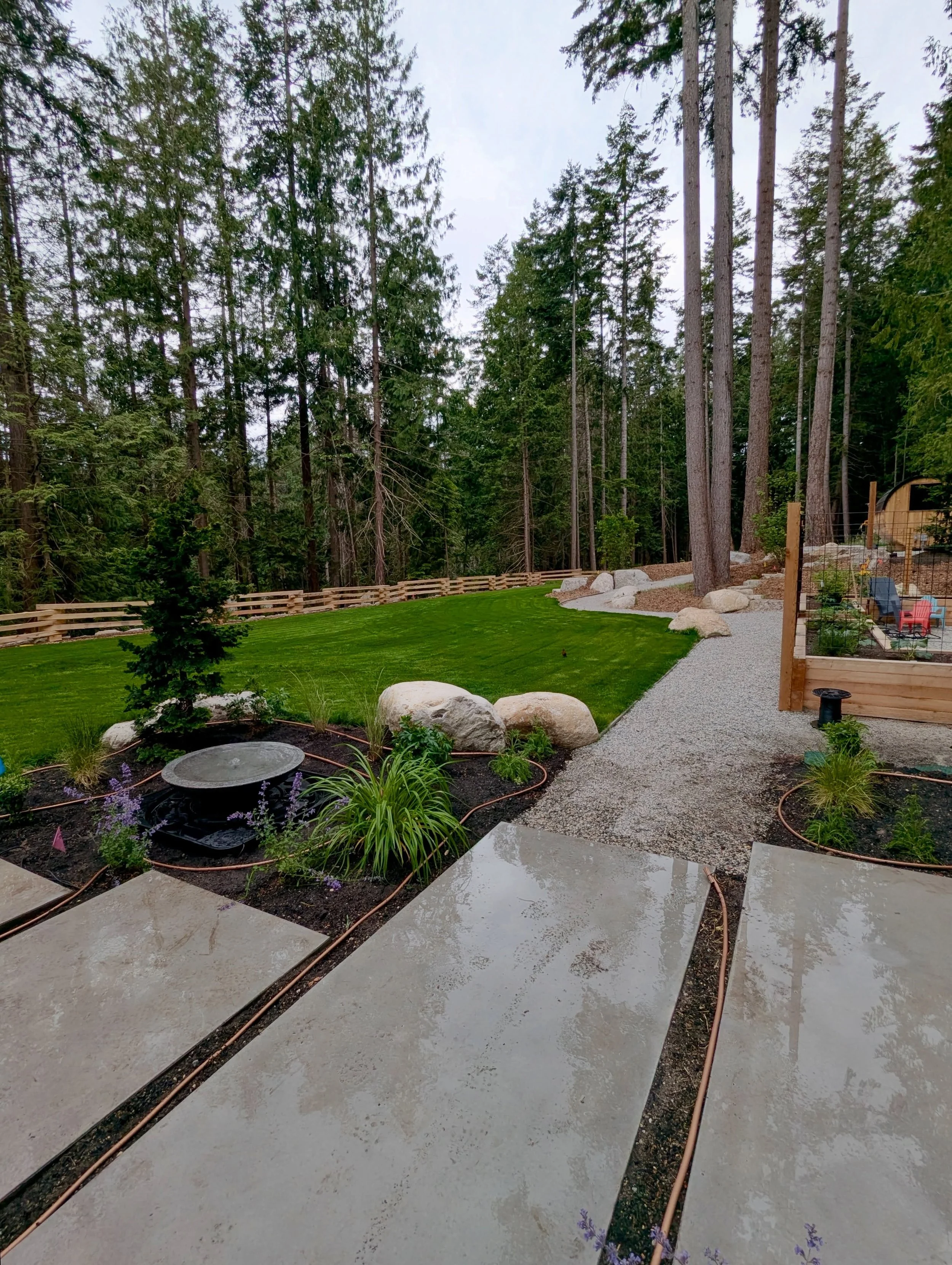 Adding some finishing touches to this amazing project. Irrigation, plants, lighting, a water feature, custom privacy fence and more!

We can&rsquo;t wait to share the completion pictures!

@h.h.developments 
@rise.concrete 
@burnett_creekforestproduc
