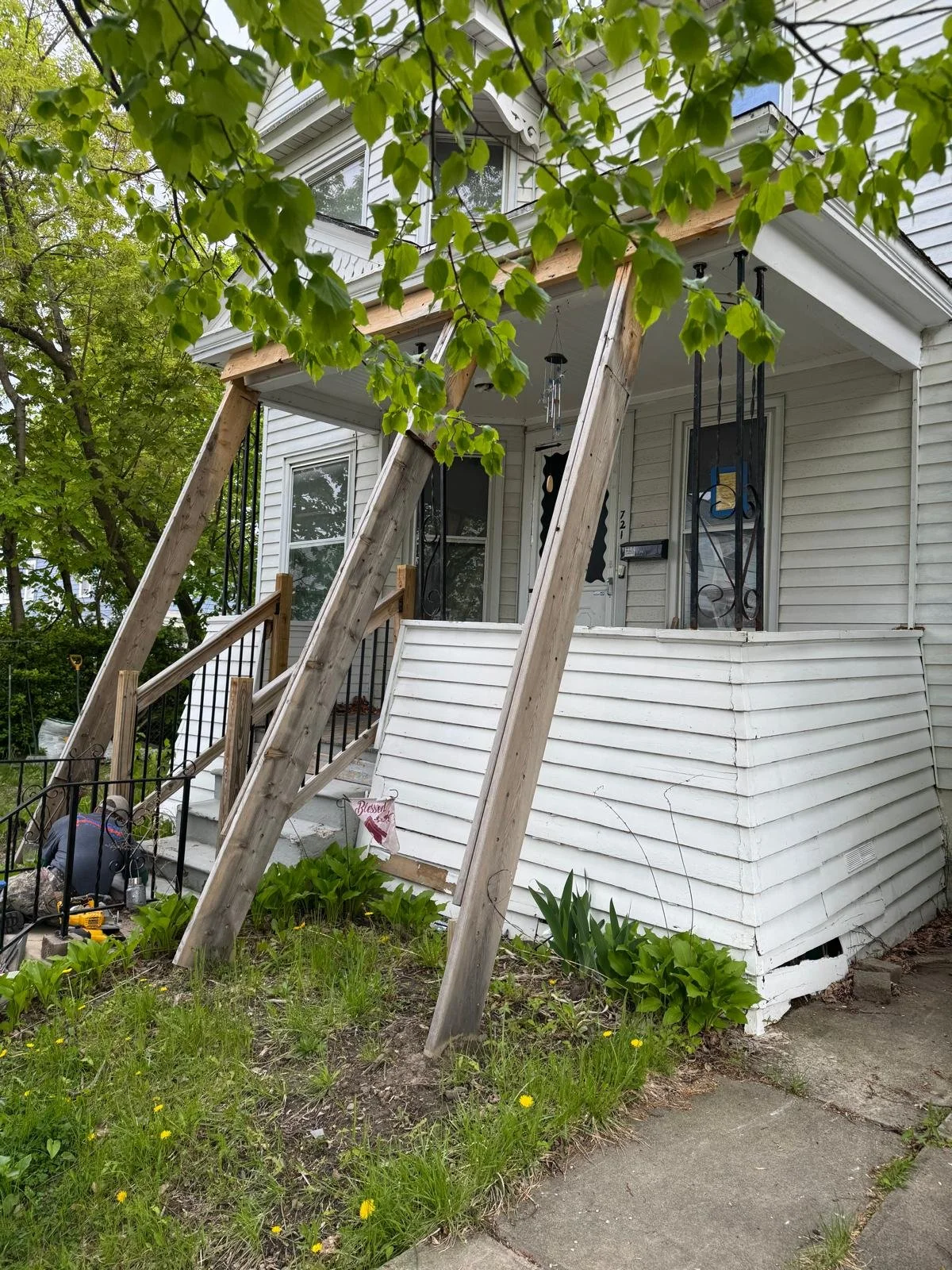 Before the rebuild: the existing porch was in poor condition and needed to be fully taken down. We demoed the old structure and rebuilt the porch from the ground up, including new supports, framing, stairs, posts, and railings for a safer, cleaner ex