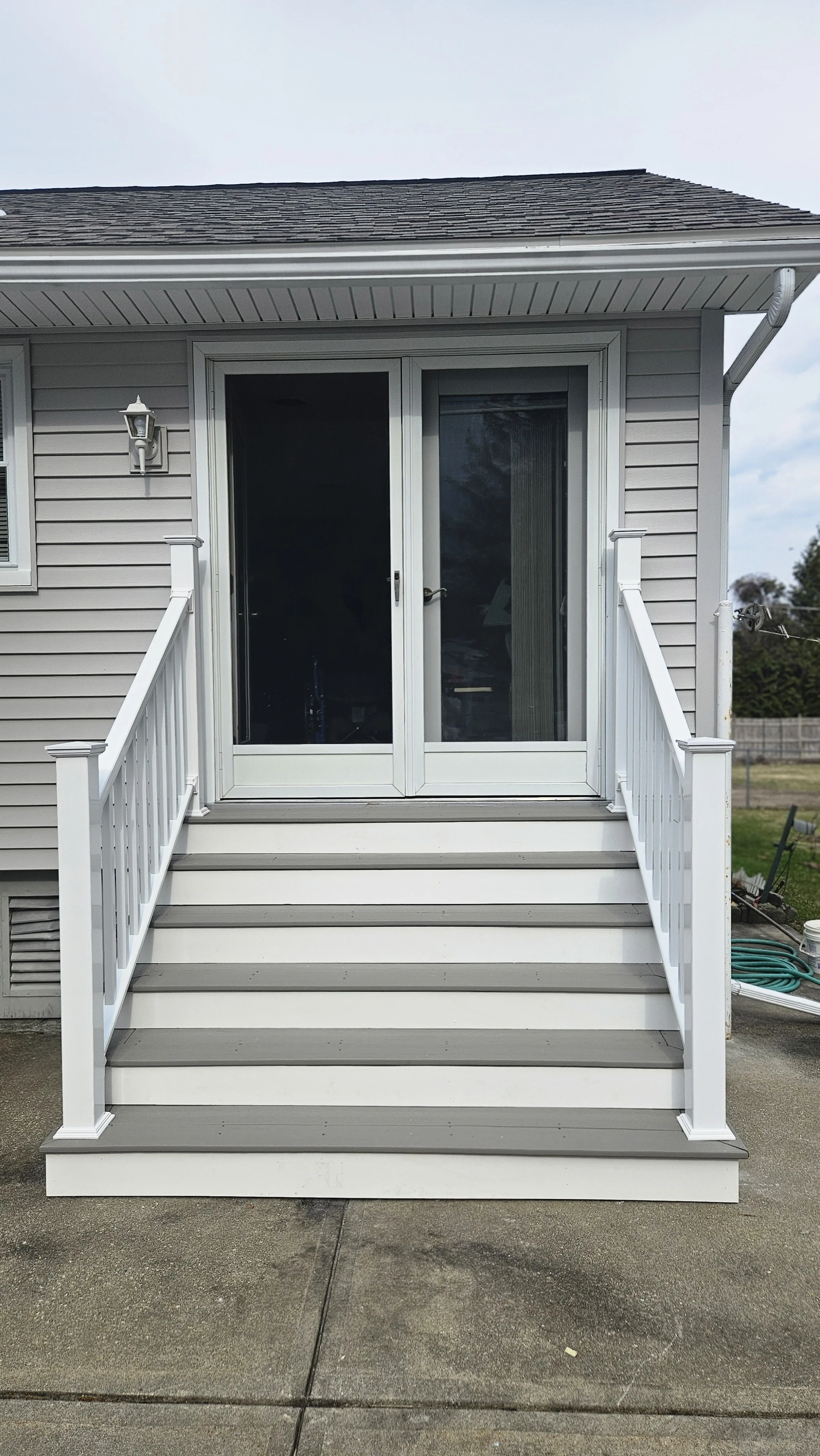 AFTER: Deck stair rebuild and railing upgrade by Regional Remodeling in the Capital Region. 
