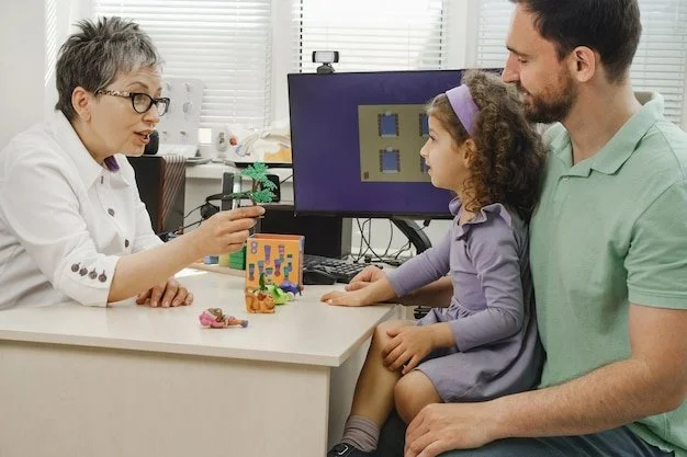 A female therapist conducting a session with a child and her father, using toys as part of the interaction. The therapist, seated at a desk, interacts with the young girl who is sitting on her father's lap. A computer and various objects are visible in the background.