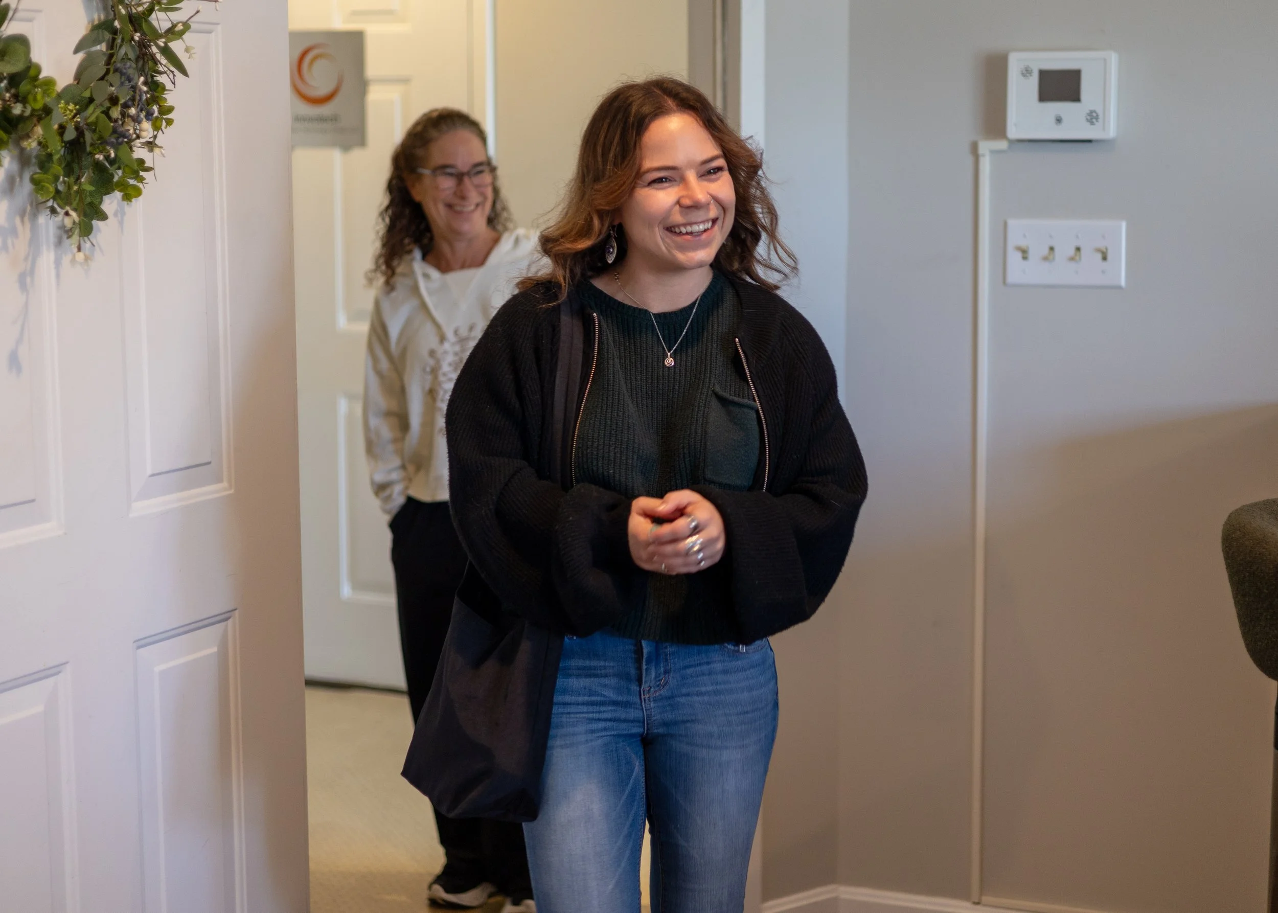 Team member Megan and her mom enter the Herbal Bar for the soft opening.