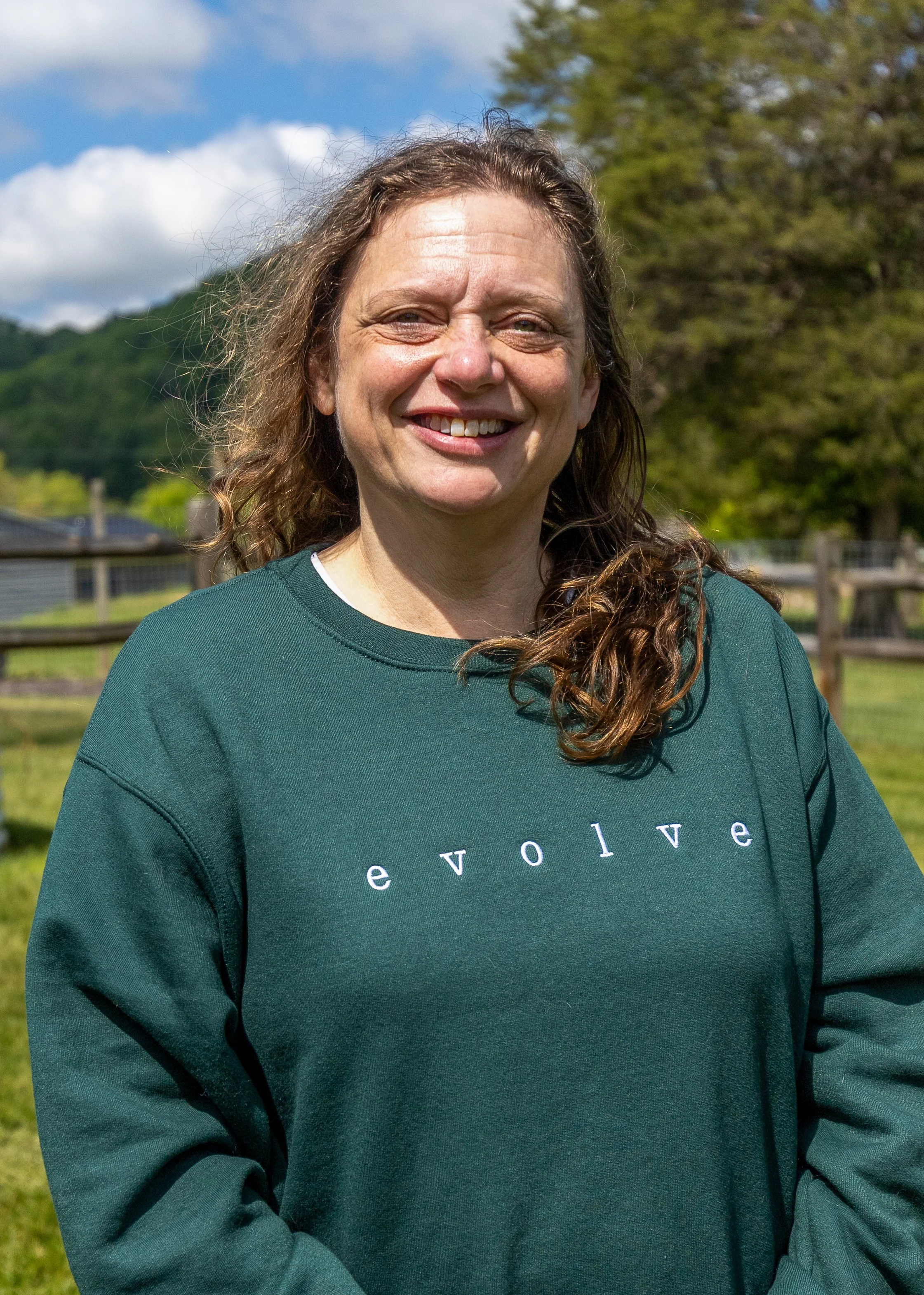 Carol Poole posing in an outdoor area.