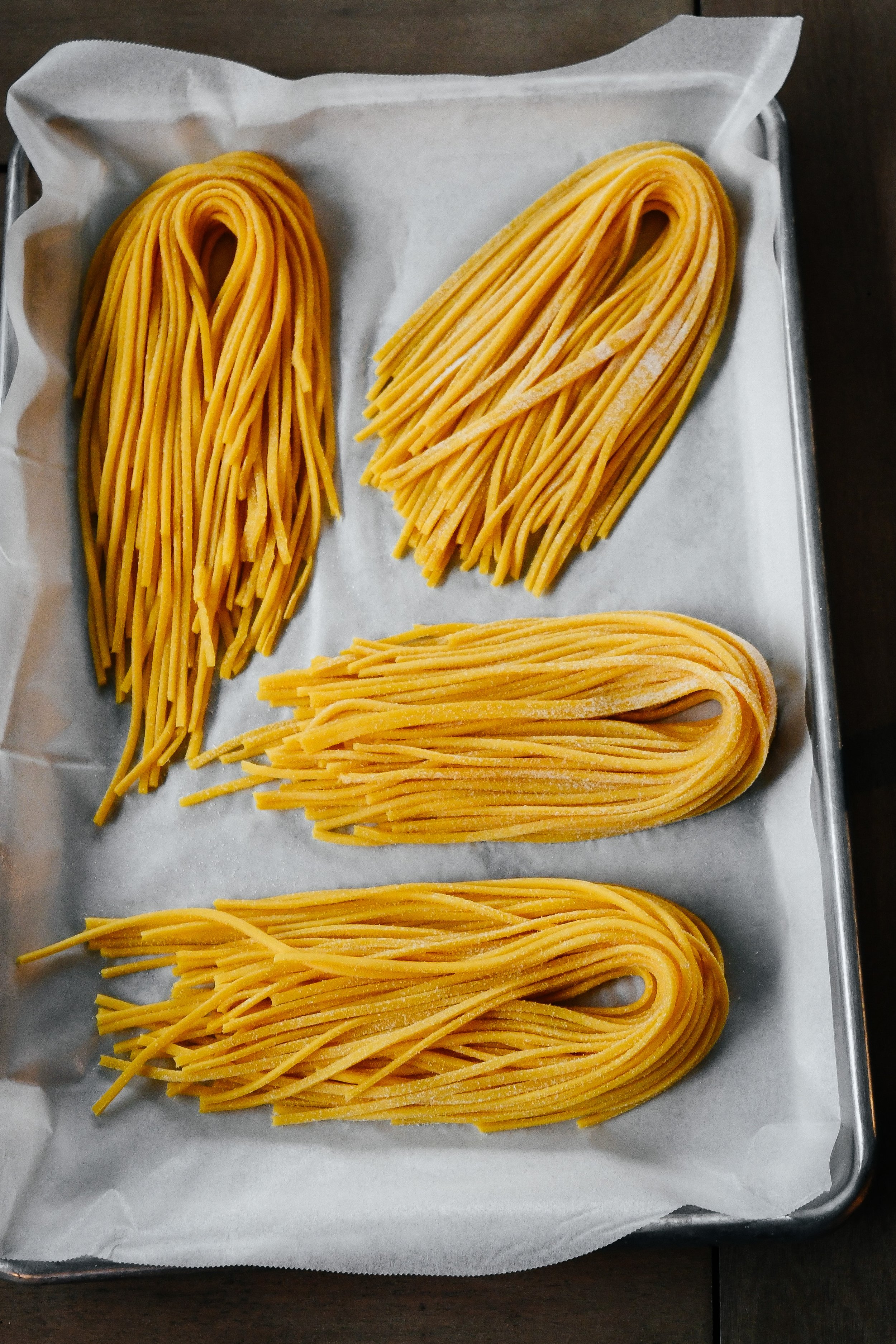Spaghetti alla Chitarra with Yellow Tomato Sugo, Basil Oil and