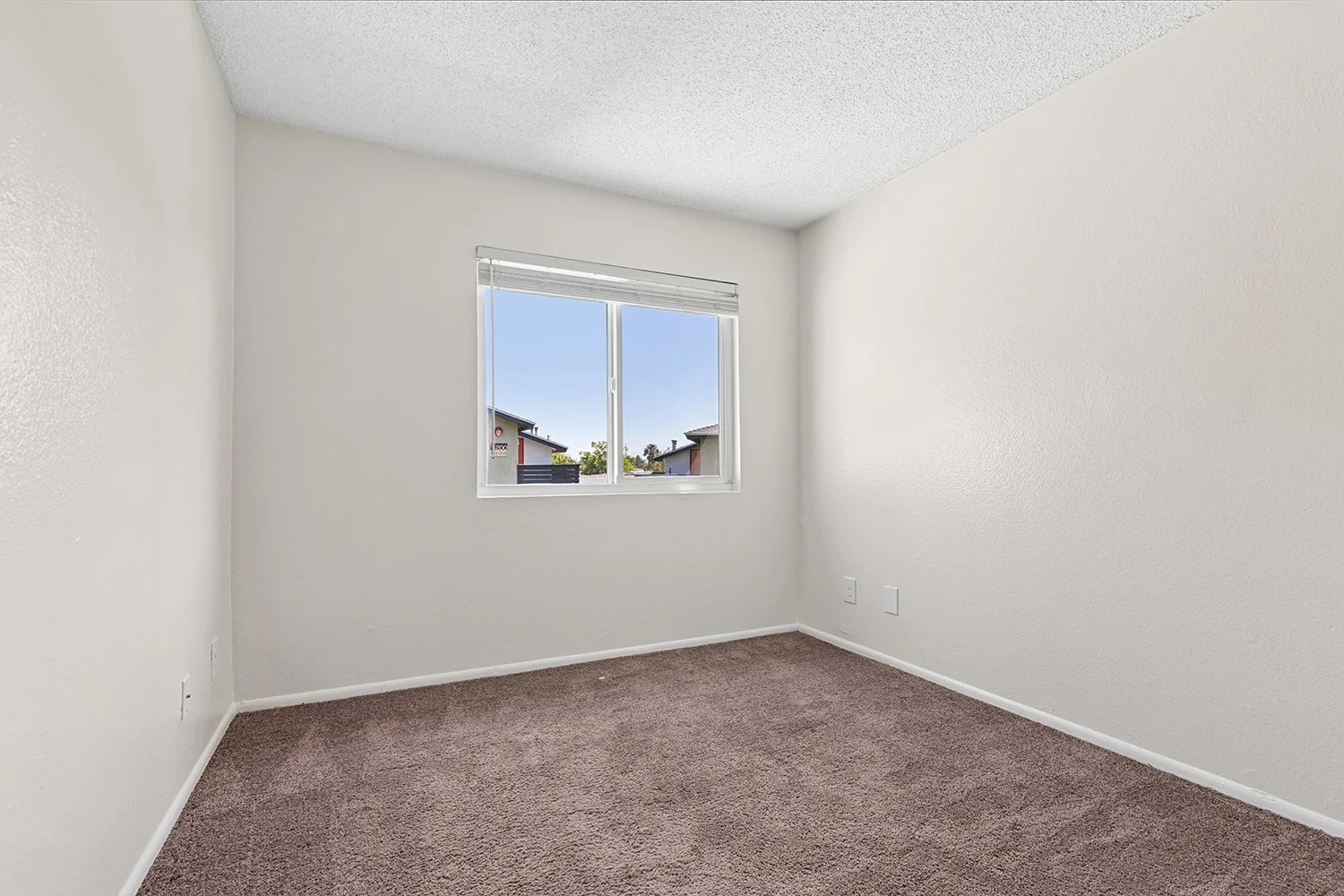 Third Bedroom in Citrus Heights 3 -bedroom apartment home with plush carpeted flooring and large window allowing for gorgeous natural lighting. 