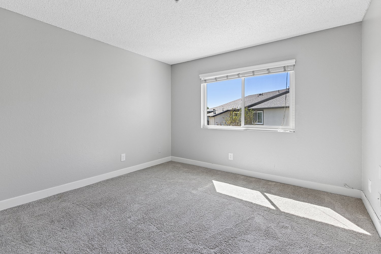 Large bedroom in 1 Bedroom Apartment at Citrus Heights with plush carpeted flooring and generously sized closet. 