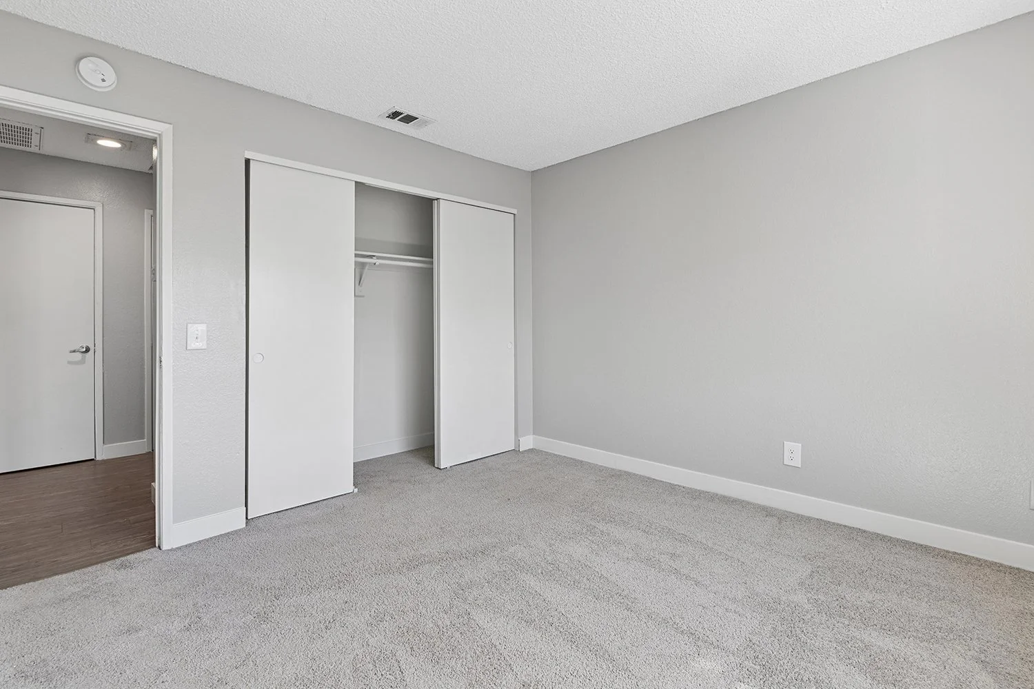 Large bedroom in 1 Bedroom Apartment at Citrus Heights with plush carpeted flooring and generously sized closet. 