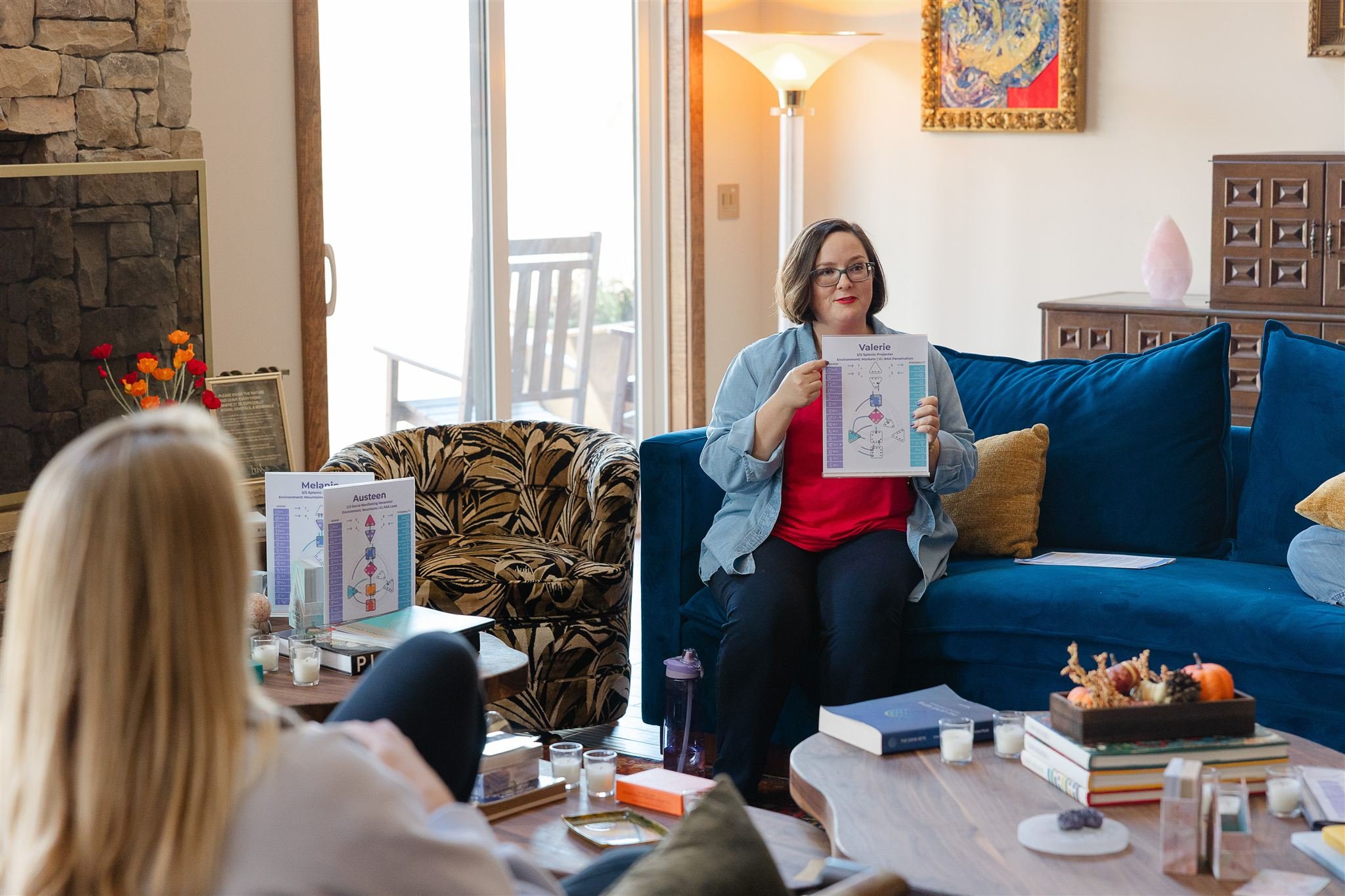 Kathryn teaching at fireplace with chart 3.jpg