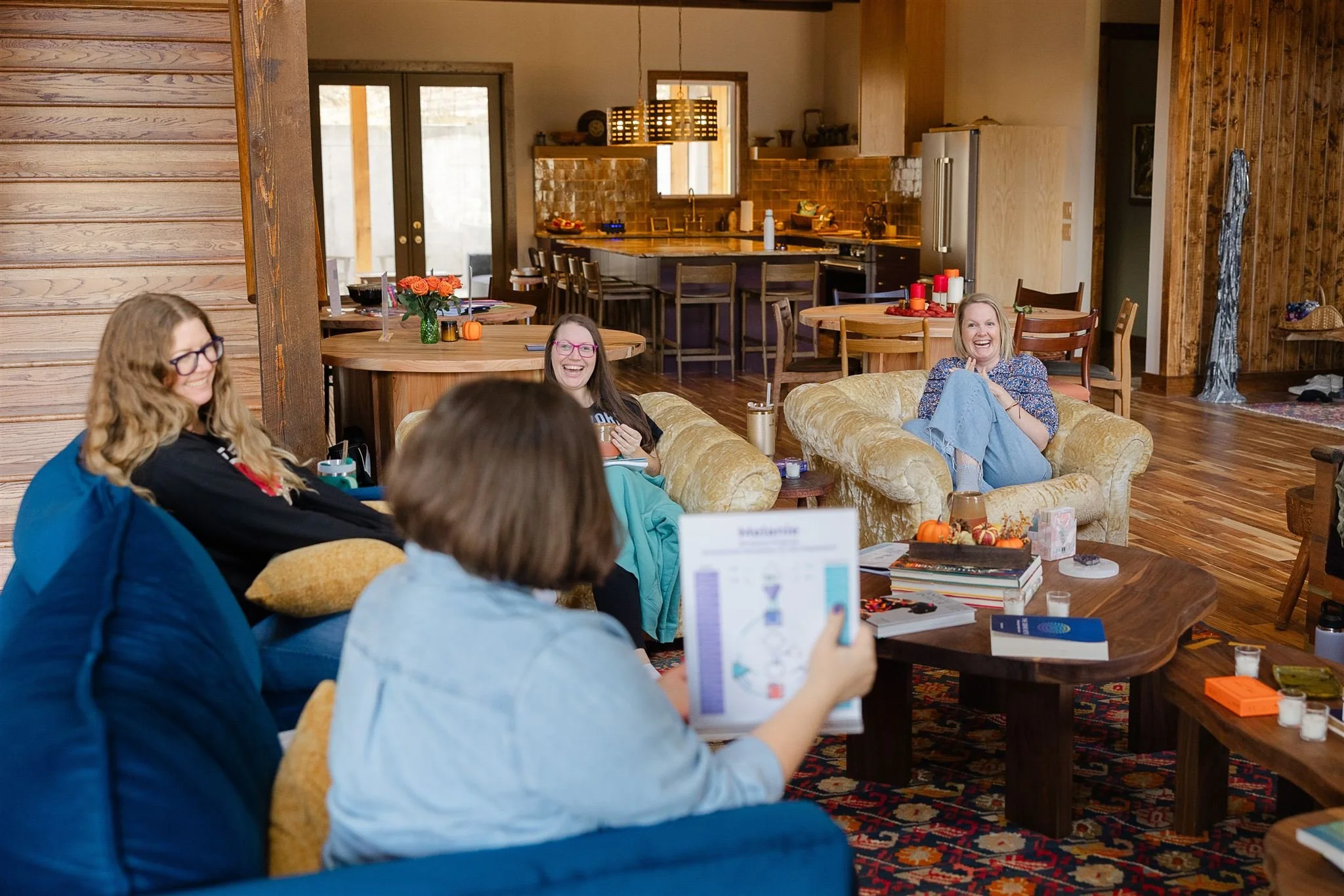 Laughing around fireplace with charts.jpg
