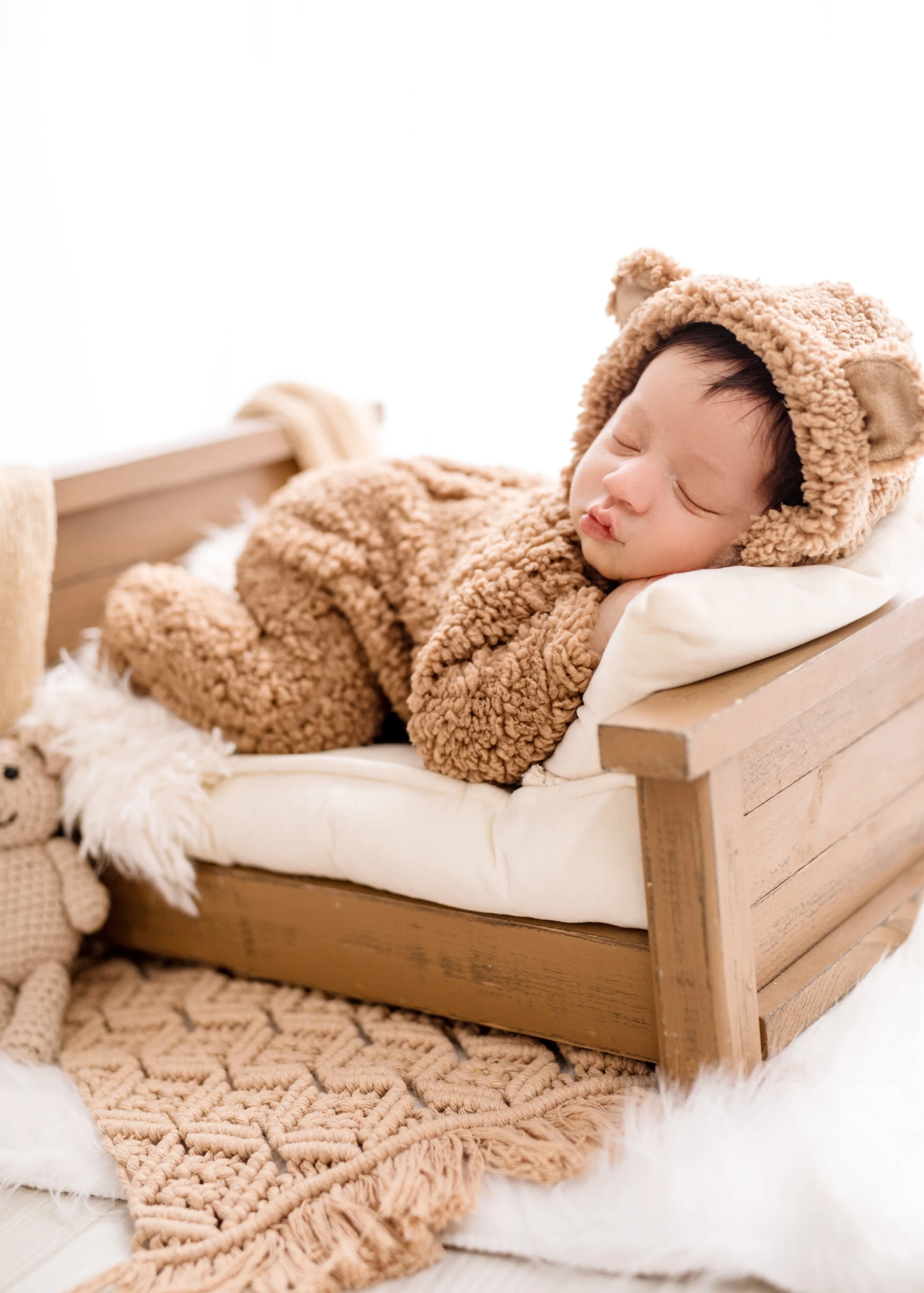 mother holding newborn baby white outfit family portrait Mississauga maternity newborn photographer GTA