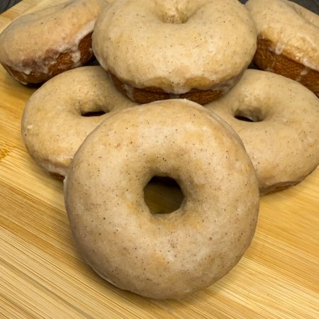close up of a pile of apple cider glazed donuts