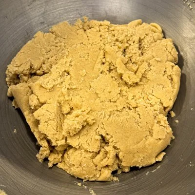 cardamom sugar cookie dough in a metal mixing bowl