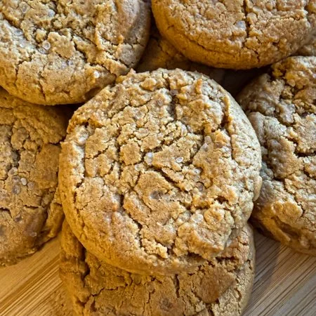 close up of a pile of honey peanut butter cookies