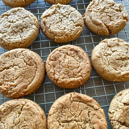 honey peanut butter cookies on a wire cooling rack