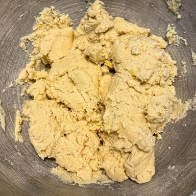 cookie dough in a metal mixing bowl