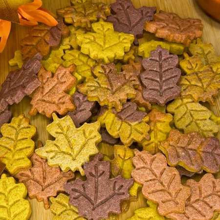 pile of fall leaf shaped cookies in multiple colors