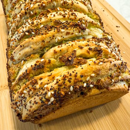 Close up of sour cream and onion bagel pull apart bread