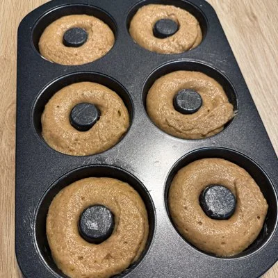 apple cider donut batter in a donut pan