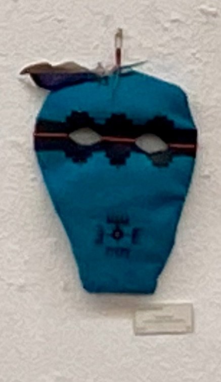 Art Wall installation by Lucca Etienne: intensely blue face mask with dark geometric patterns