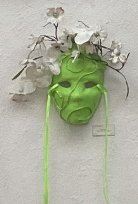 Art Wall installation by Lucca Etienne: green face mask .