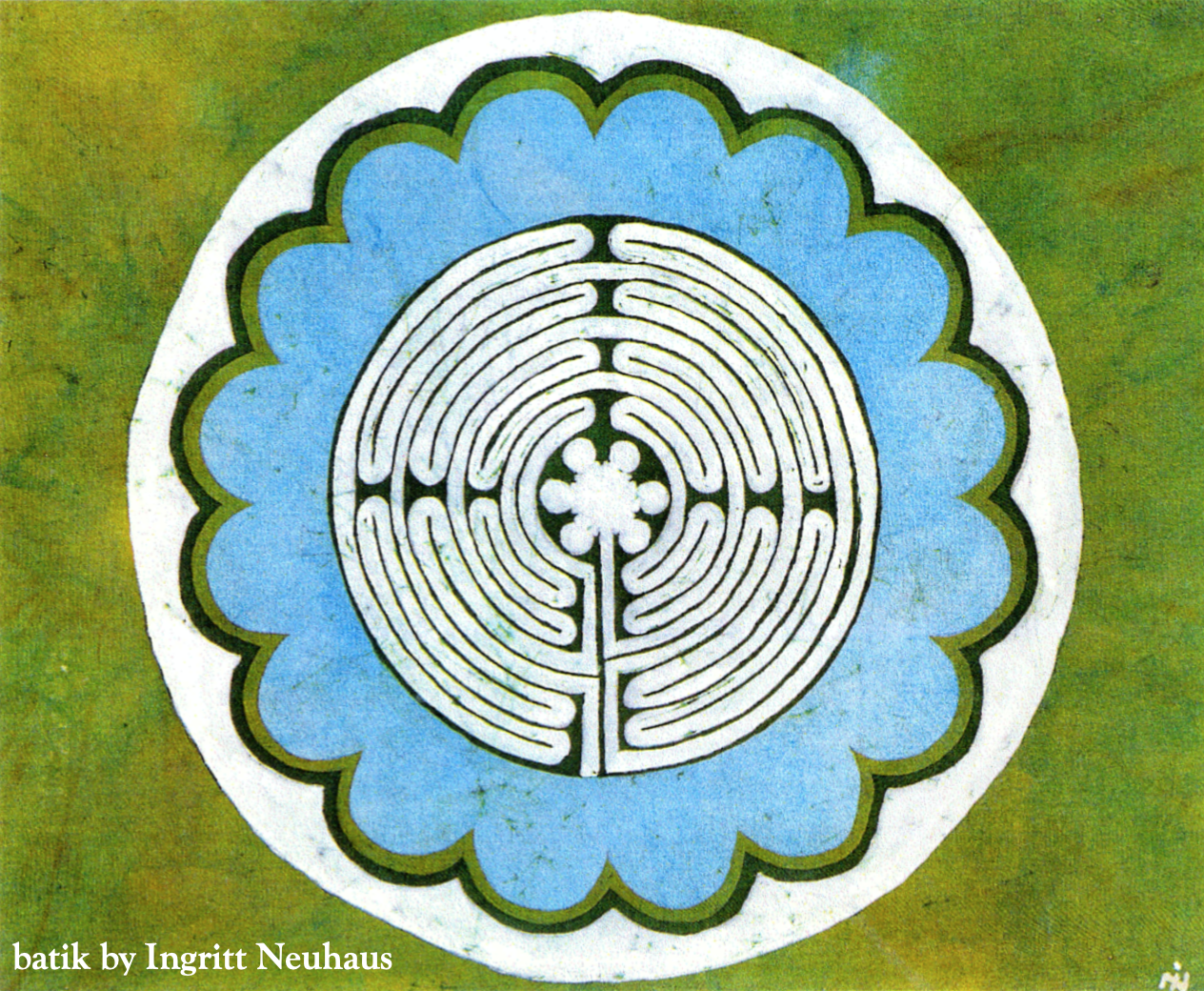an image of a black and white labyrinth at the center of a light blue dark scalloped-edge circle, surrounded by a white circle on a mottled green field, image rendered in batik by Ingritt Neuhaus
