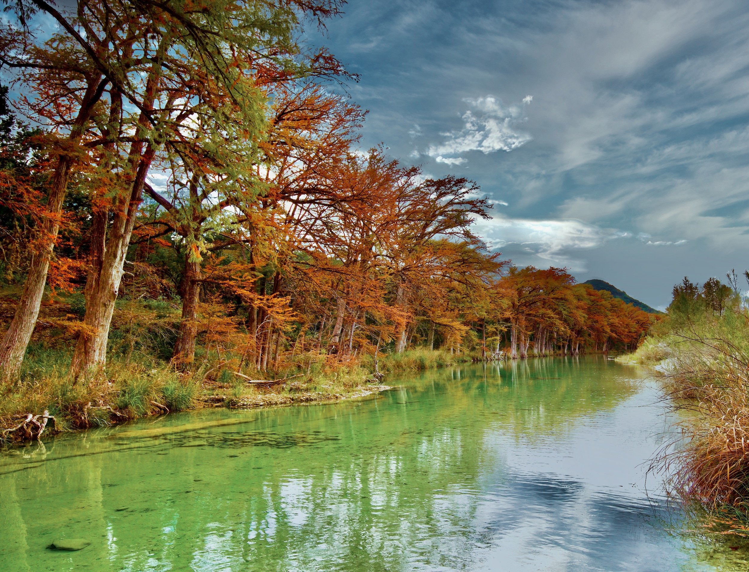 " Peace along the Frio "  Garner State Park where cypress trees create a magical feeling against the clear green water
