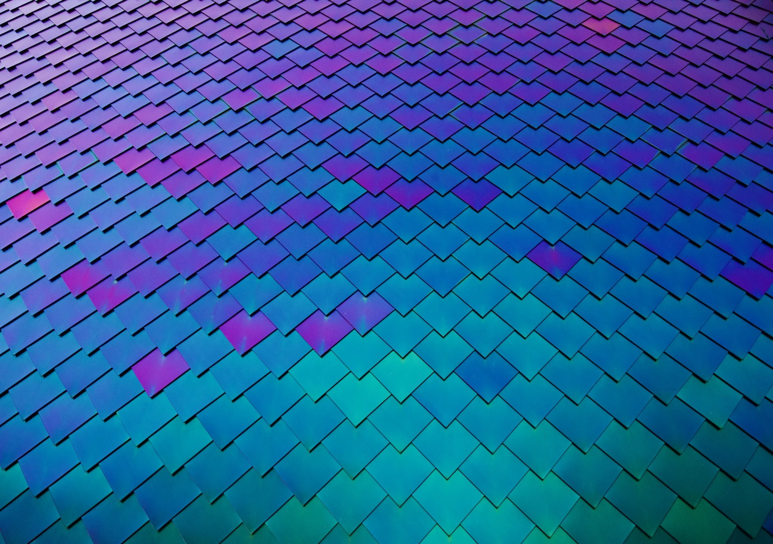 " Liquid Metal " Iridescent architectural tiles shifting between blue and violet in contemporary photography.