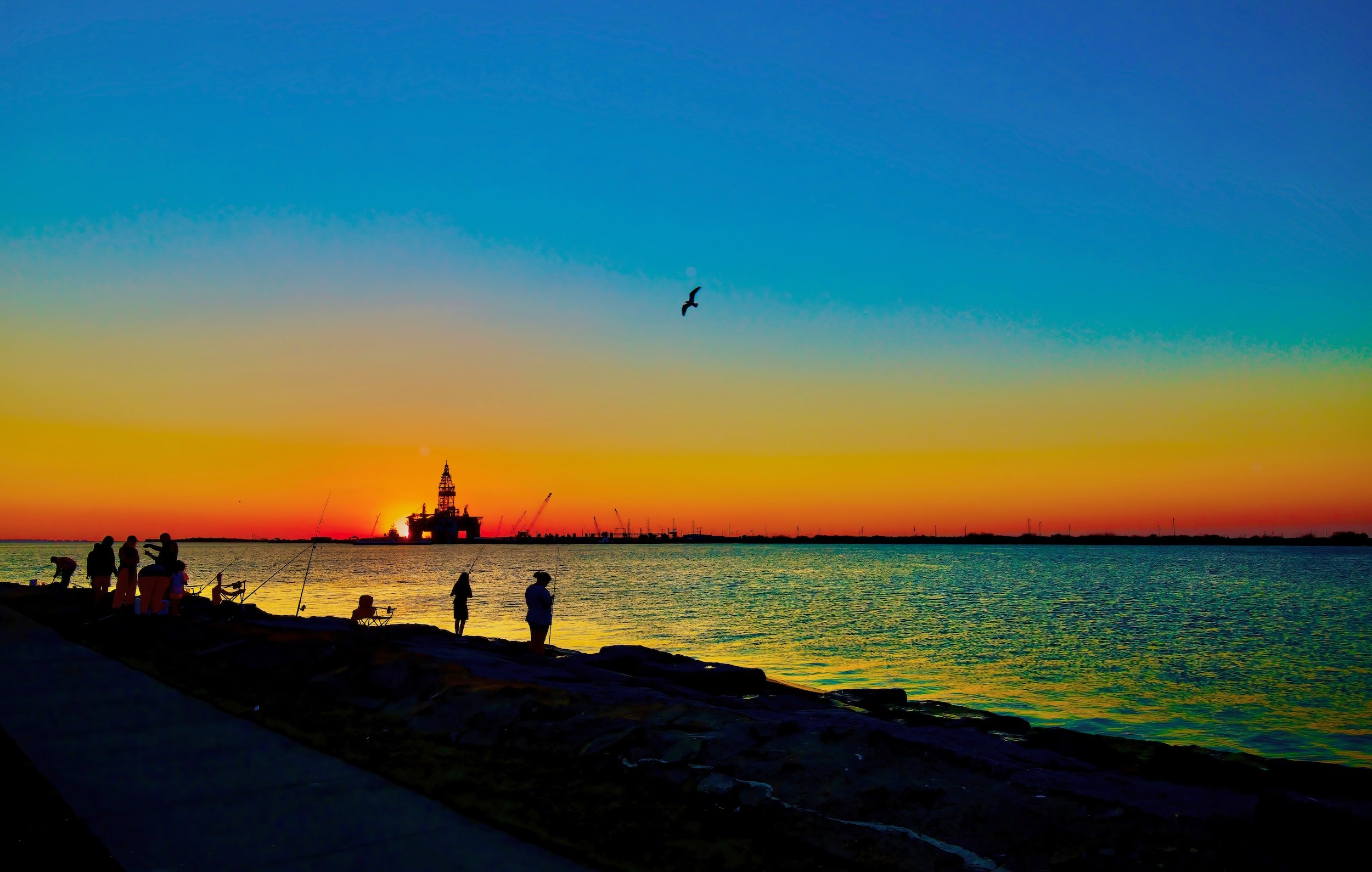 " Last Cast " Peaceful anglers silhouetted beneath a vibrant Texas sunset.