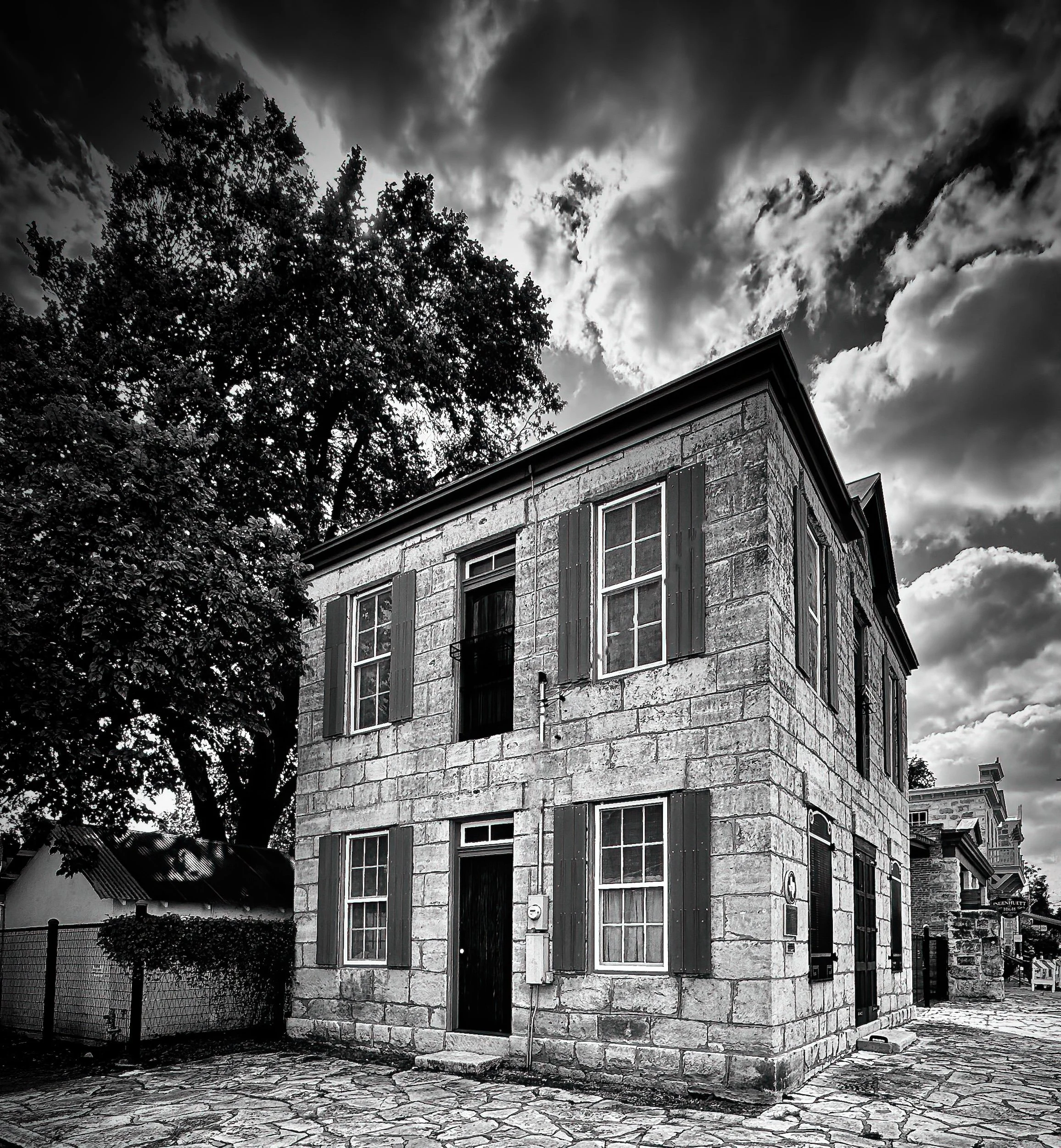 "Waiting for the Mail" Historic limestone Post Office beneath dramatic skies enduring Texas heritage.