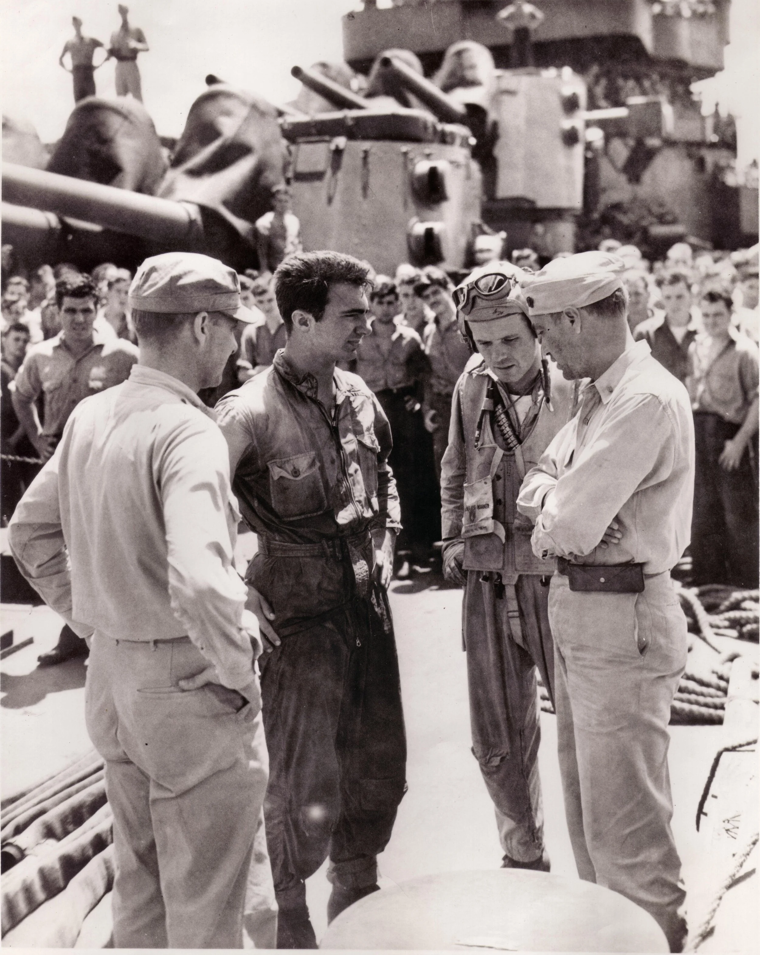 Pete in his wet flight suit on the deck of the invasion feet flagship, USS Phoenix.