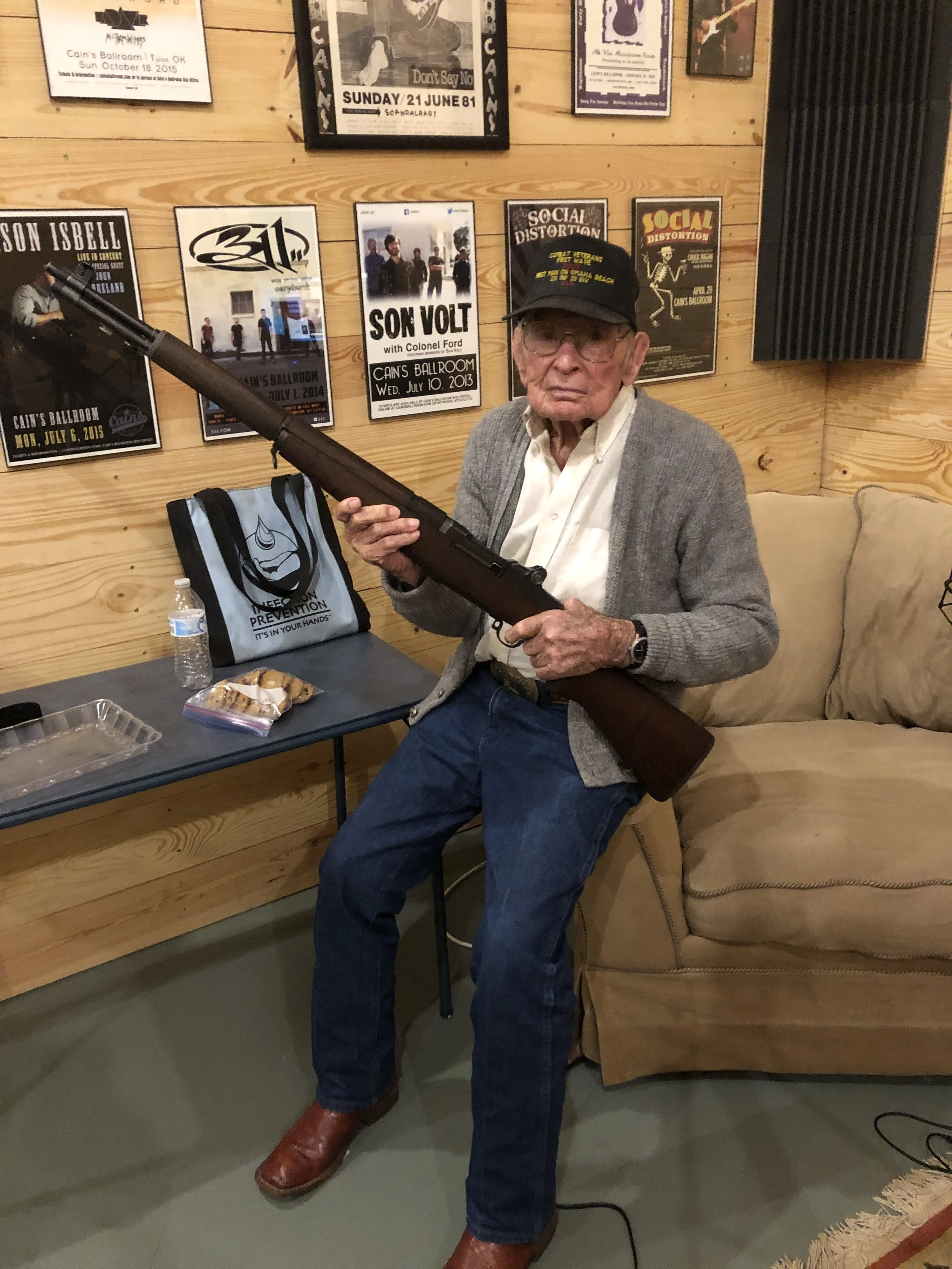 Bill visits our recording studio at the Green Barn and is given the same rifle, the M1 Garand, he used during the war. Notice which hand is on the trigger…Bill is a lefty!