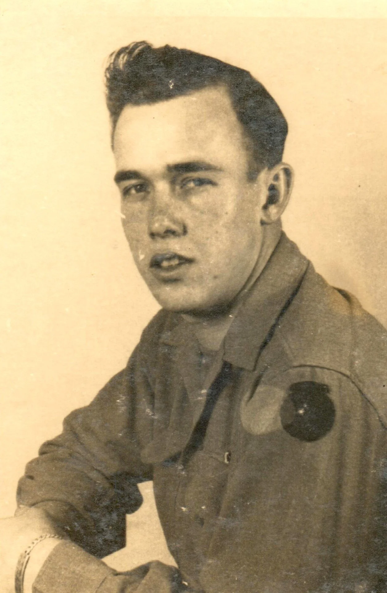 A sunburned John in uniform