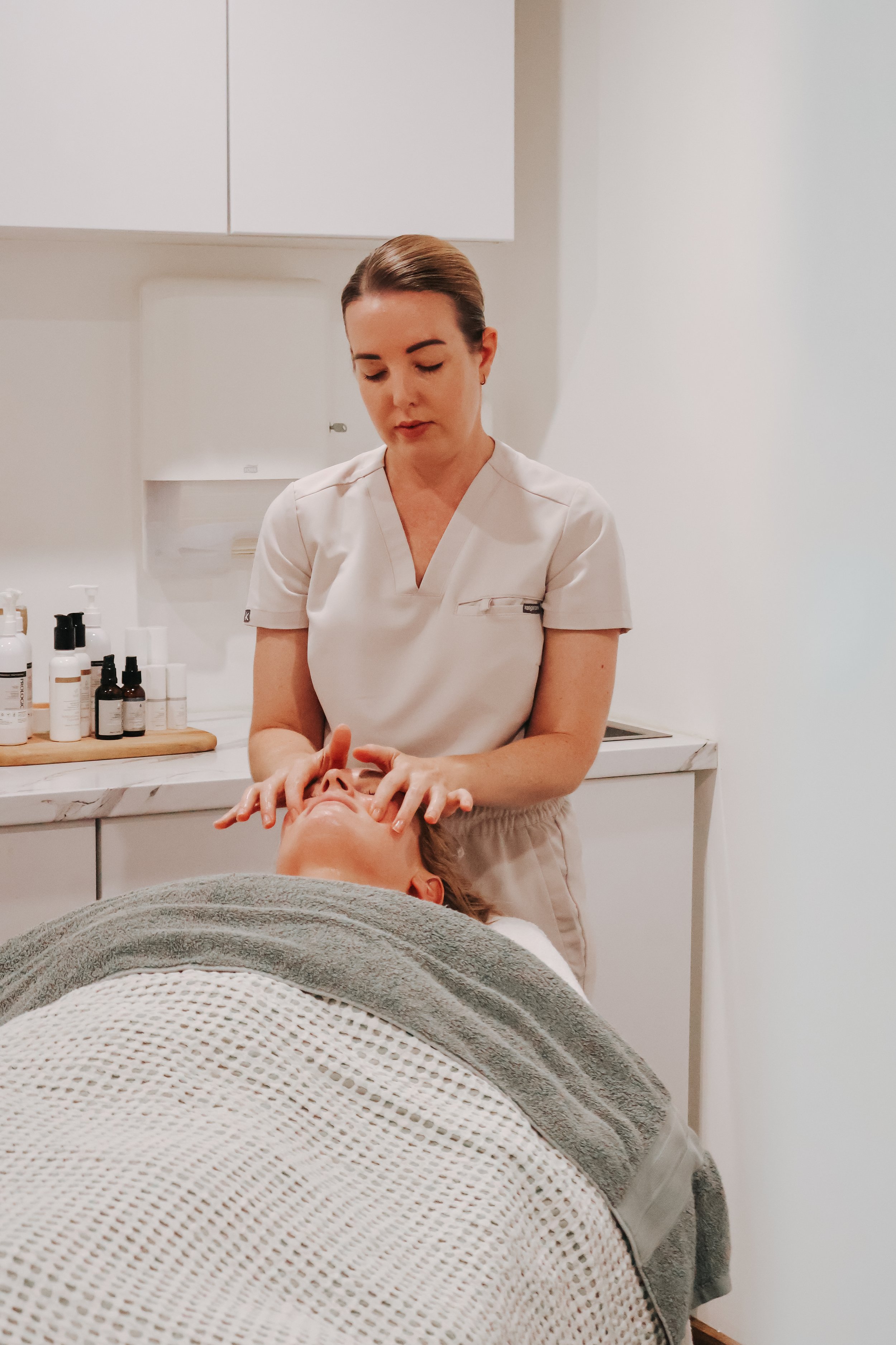 Emma performing a personalised facial treatment at Vitality Skin & Beauty in Buddina