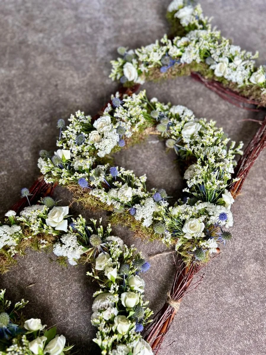 Funeral flowers eco letters blue and white.jpg