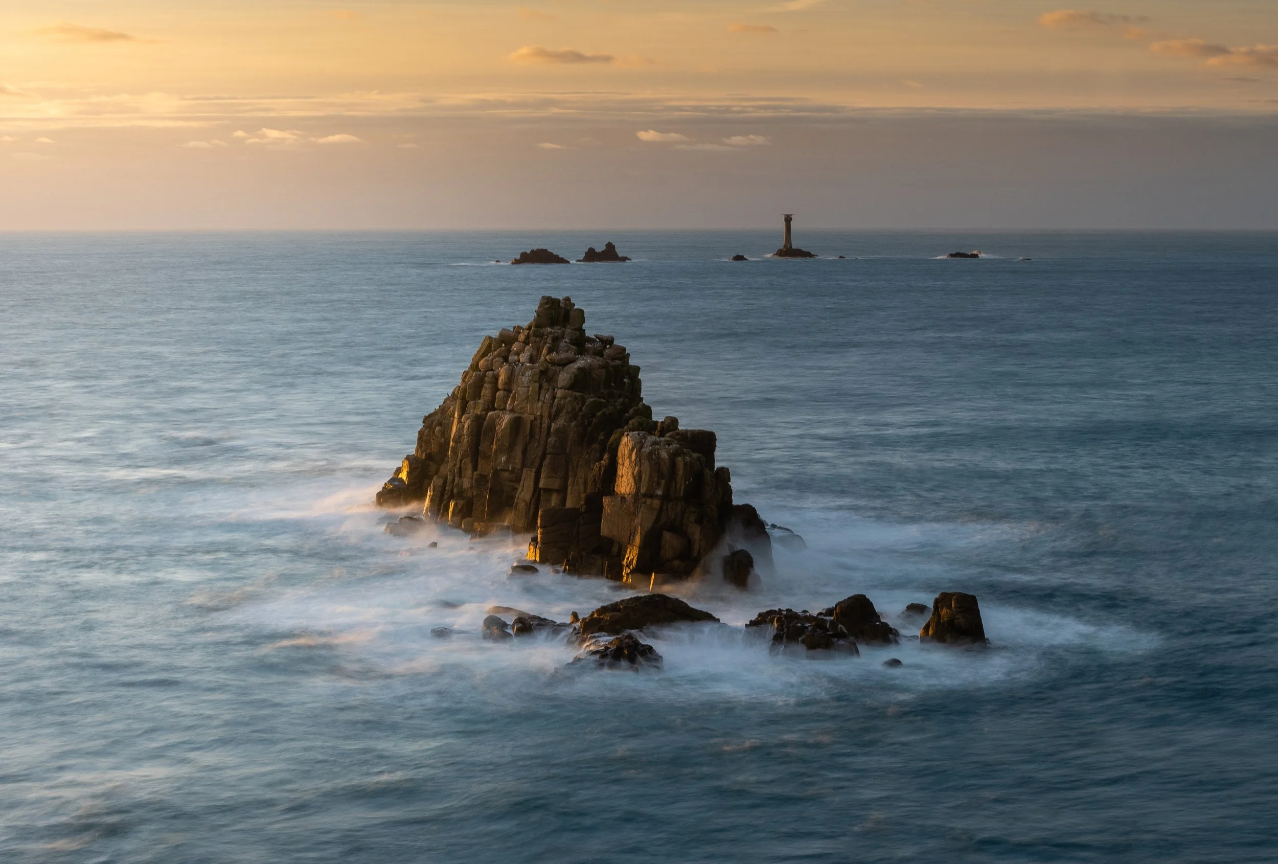 Sunset at Armed Knight Sea Stack and Long Ships Lighthouse, Lands End Cornwall