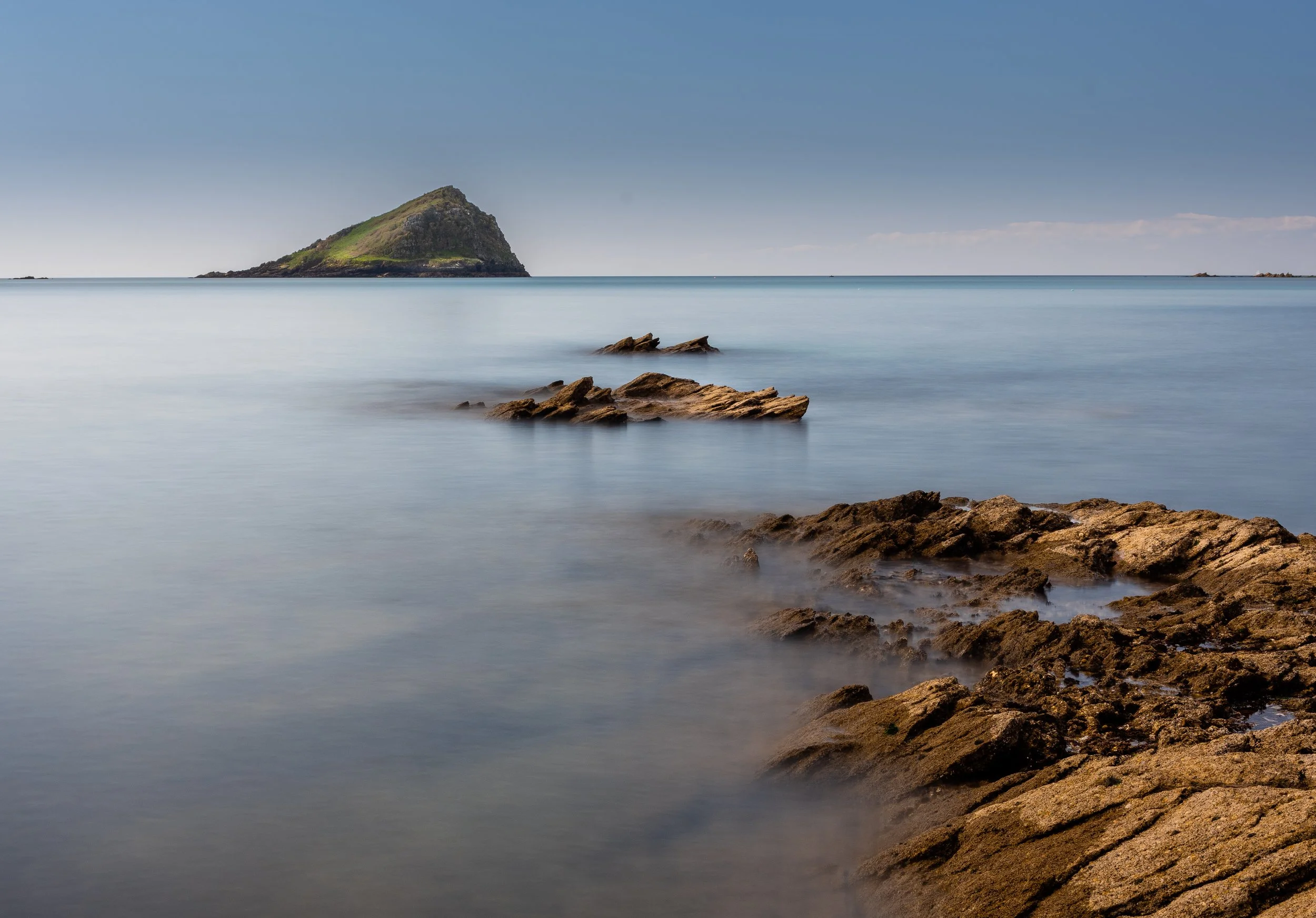 Leading line of rocks out to Mewstone, from Wembury Point, Devon