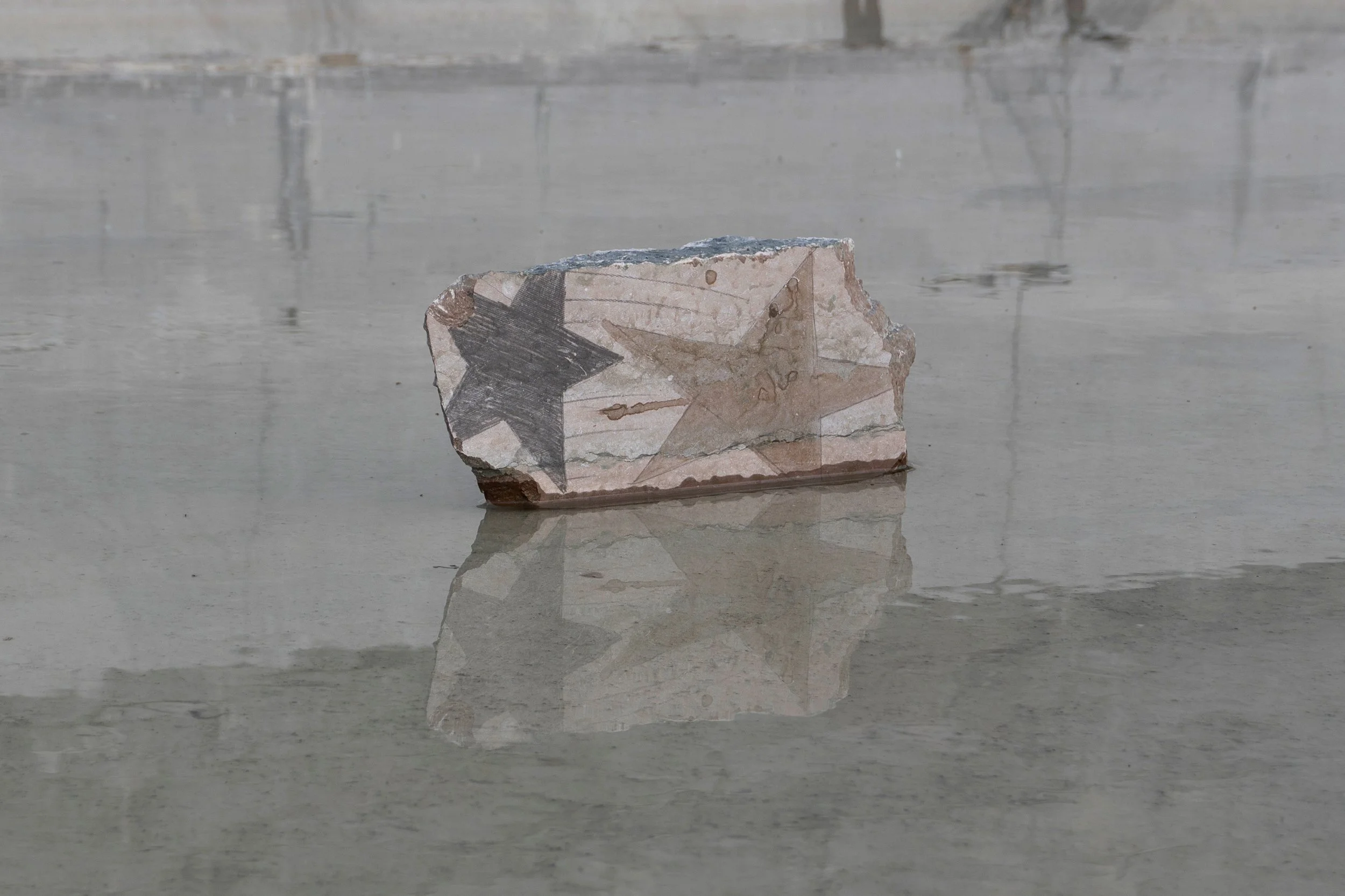 In the Bag of Stars (III).
Graphite and acid on lime stone.