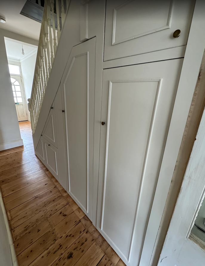 Understair storage solutions in terraced house in Brighton finshed in white