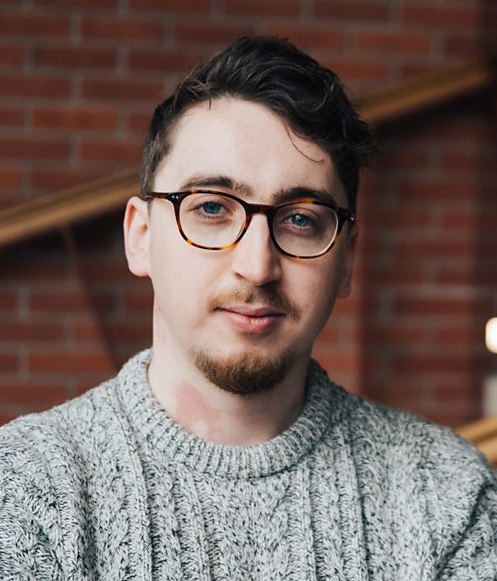 A white man with glasses and a goatee