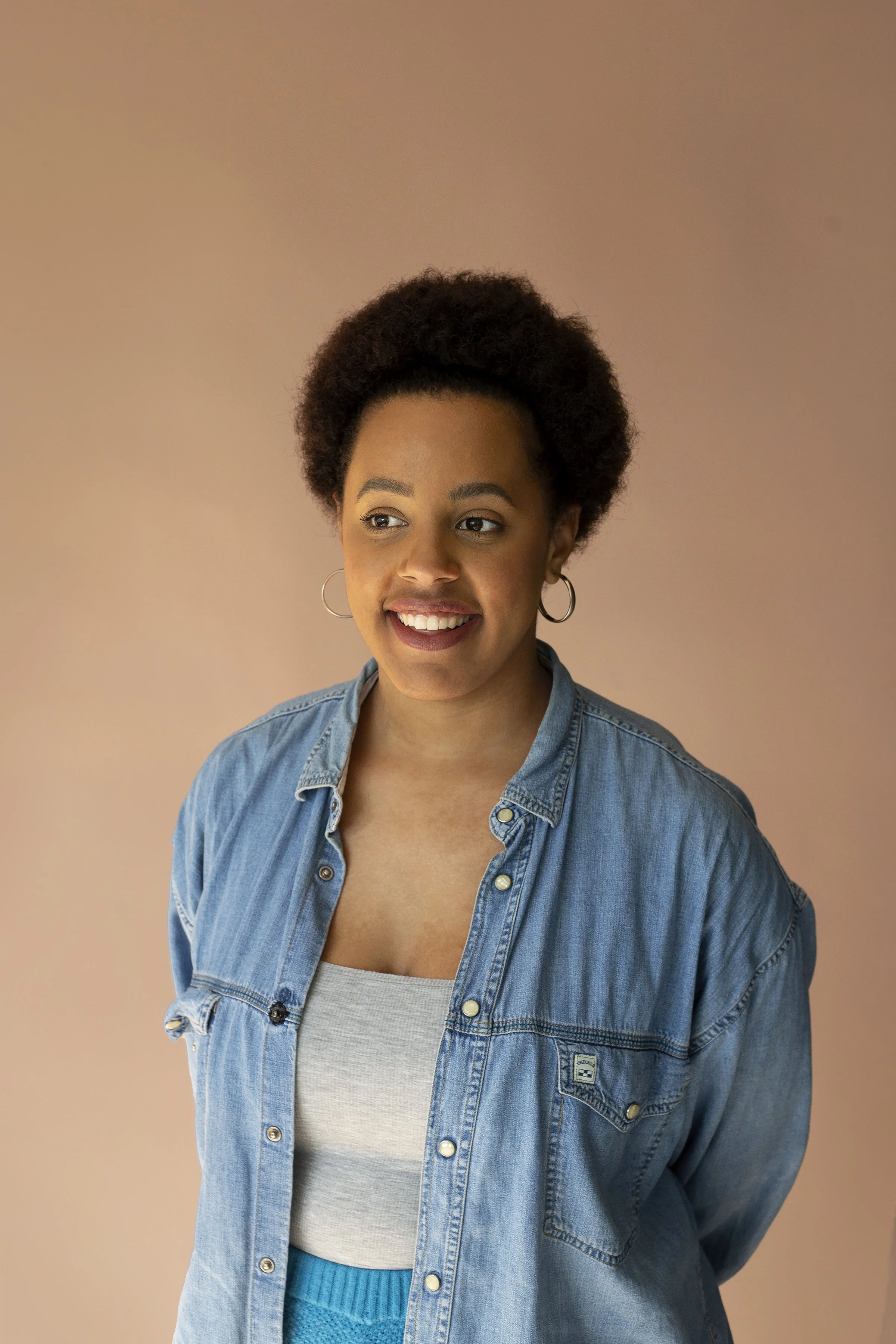 A young black woman with short afro hair