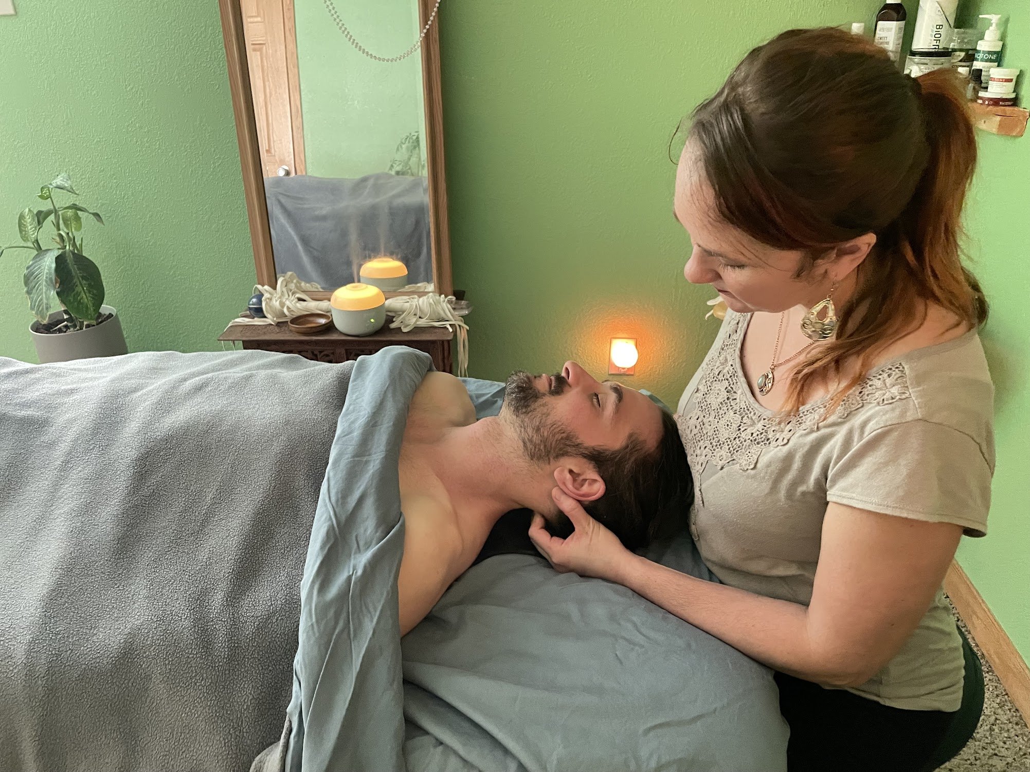 kiah massaging man's neck
